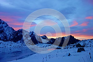 Mountain lake called Litvorove pleso in High Tatras mountains during winter sunset, Slovakia