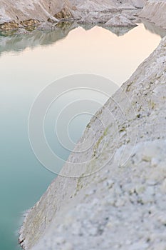 Mountain lake with emerald water at sunset