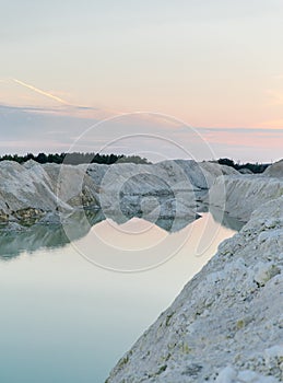 Mountain lake with emerald water at sunset