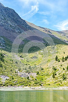 Mountain lake Estany de les Truites in Andorra Pyrenees, La Massana, Refugi de Coma Pedrosa photo