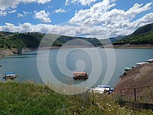 Mountain lake in Europe with a boat