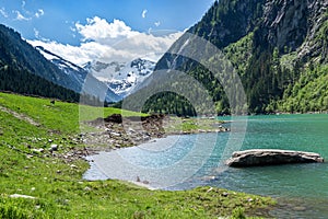 Mountain lake landscape in the Alps, Austria, Tyrol, Stilluptal Lake, Zillertal Alps photo