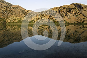 Mountain lake landscape with reflection in water