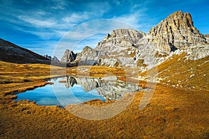 Mountain lake near Tre Cime di Lavaredo peaks, Dolomites, Italy