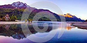 Mountain lake panorama with mountains reflection. Idyllic look. Autumn forest. Silvaplana Lake,