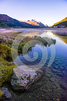 Mountain lake panorama with mountains reflection. Idyllic look. Autumn forest. Silvaplana Lake,