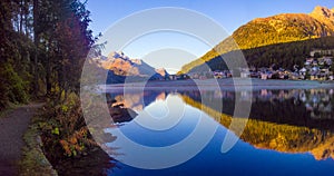 Mountain lake panorama with mountains reflection. Idyllic look. Autumn forest. Silvaplana Lake,