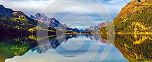 Mountain lake panorama with mountains reflection. Idyllic look. Autumn forest. Silvaplana Lake,