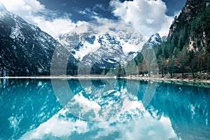 Mountain lake with perfect reflection at sunny day in autumn