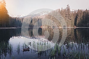 Mountain lake at sunny morning