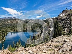 Mountain lake with trees and snow