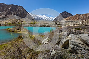 Mountain lake under the sunny day with blue sky along Karakorum Highway in Passu, Hunza district