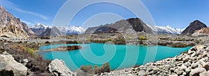 Mountain lake under the sunny day with blue sky along Karakorum Highway in Passu, Hunza district