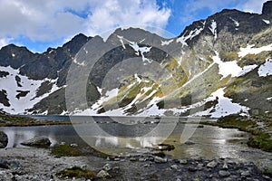 The mountain lake Vel`ke Hincovo pleso with the Mengusovske mountains in the High Tatras photo