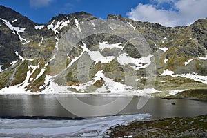 The mountain lake Vel`ke Hincovo pleso with the Mengusovske mountains in the High Tatras photo