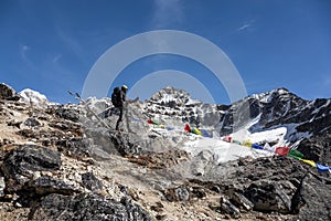 Mountain Landscape and Alpine Climber taking Picture on Mobile Telephone