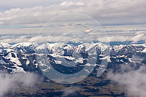 Mountain landscape in the Alps - white clouds between the peaks