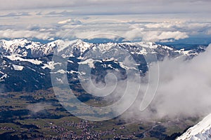 Mountain landscape in the Alps - white clouds between the peaks