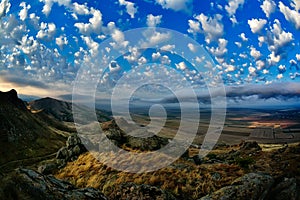 Mountain landscape with beautiful sky in Dobrogea, Romania photo