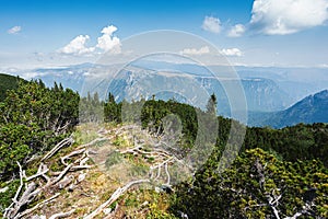 Mountain landscape with blue sky and white clouds.