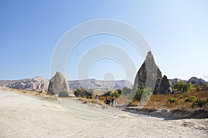 Mountain landscape in the Cappadocia National Park. Yellow and brown mountains made of natural tuff.