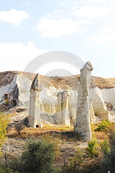 Mountain landscape in the Cappadocia National Park. Yellow and brown mountains made of natural tuff.