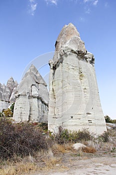 Mountain landscape in the Cappadocia National Park. Yellow and brown mountains made of natural tuff.