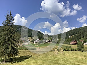 mountain landscape with clouds and houses