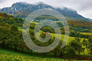 Mountain landscape, cloudy day with haze over the rock