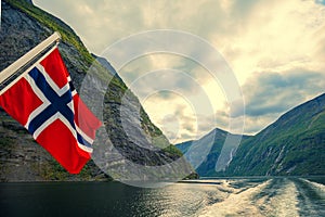Majestic Geiranger fjord.  View from ship. Norvegian flag photo