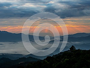 Mountain landscape with colorful vivid sunset on the cloudy sky