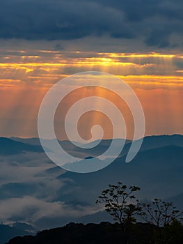 Mountain landscape with colorful vivid sunset on the cloudy sky