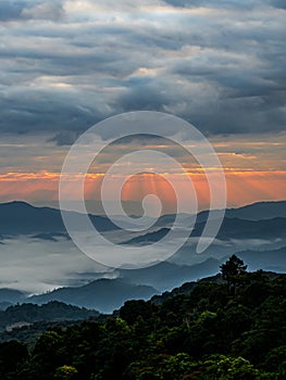 Mountain landscape with colorful vivid sunset on the cloudy sky