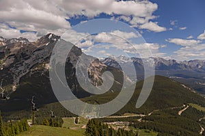 Mountain landscape - coniferous forest,. Summer tourism - ski lift to the mountain. Banff, Alberta, Canada