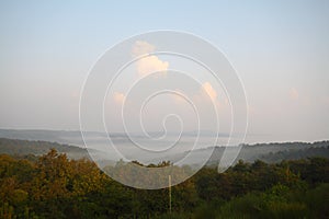 Mountain landscape in the fog. house in the mountains. The old spooky house on the land of nowhere. Wooden house in the middle of