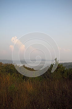 Mountain landscape in the fog. house in the mountains. The old spooky house on the land of nowhere. Wooden house in the middle of