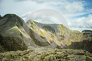 A mountain landscape with a Folgefonna glacier in the distance. A distant scenery of ice.