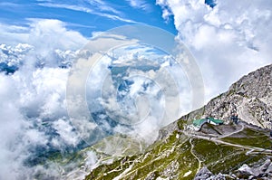 Mountain landscape with forest and blue sky in Austrian Alps