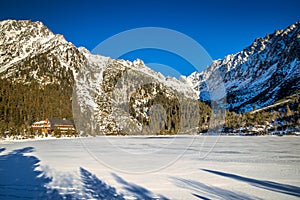 Mountain landscape with frozen tarn at winter season