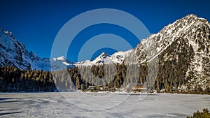 Mountain landscape with frozen tarn at winter season