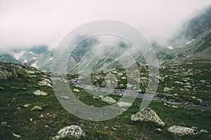 Mountain landscape. High mountains in the fog.