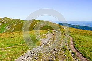 Mountain landscape on a hiking trail in the Low Tatras, Slovakia. View of mountain peaks and valleys while hiking along a mountain