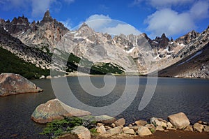 Mountain landscape with lake, Nahuel Huapi National Park, Toncek lagoon surrounded by steep granite rocks and Torre Principal peak photo