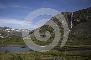 Mountain landscape with lake and waterfall, Norway