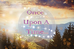 Mountain landscape with magic lights and text Once upon a time. Fairy tale world