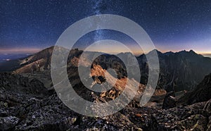 Mountain landscape with night sky and Mliky way, Slovakia Tatras from peak Slavkovsky stit