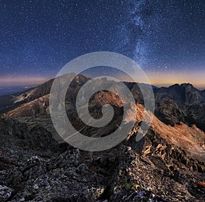 Mountain landscape with night sky and Mliky way, Slovakia Tatras from peak Slavkovsky stit