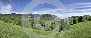 mountain landscape panorama with forests and pastures photo