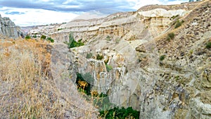 Mountain landscape in Pigeon valley in Cappadocia, Turkey. Unreal rock formations of Cappadocia