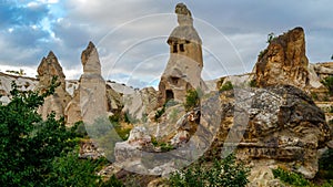 Mountain landscape in Pigeon valley in Cappadocia, Turkey. Unreal rock formations of Cappadocia